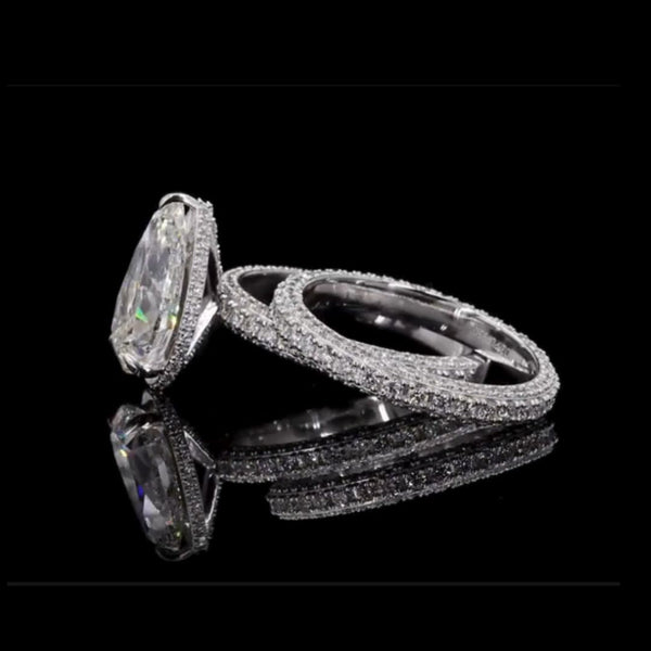 Dazzle in Timeless Beauty with this Pear-shaped Diamond Ring Pair