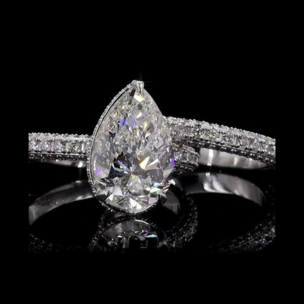 Dazzle in Timeless Beauty with this Pear-shaped Diamond Ring Pair